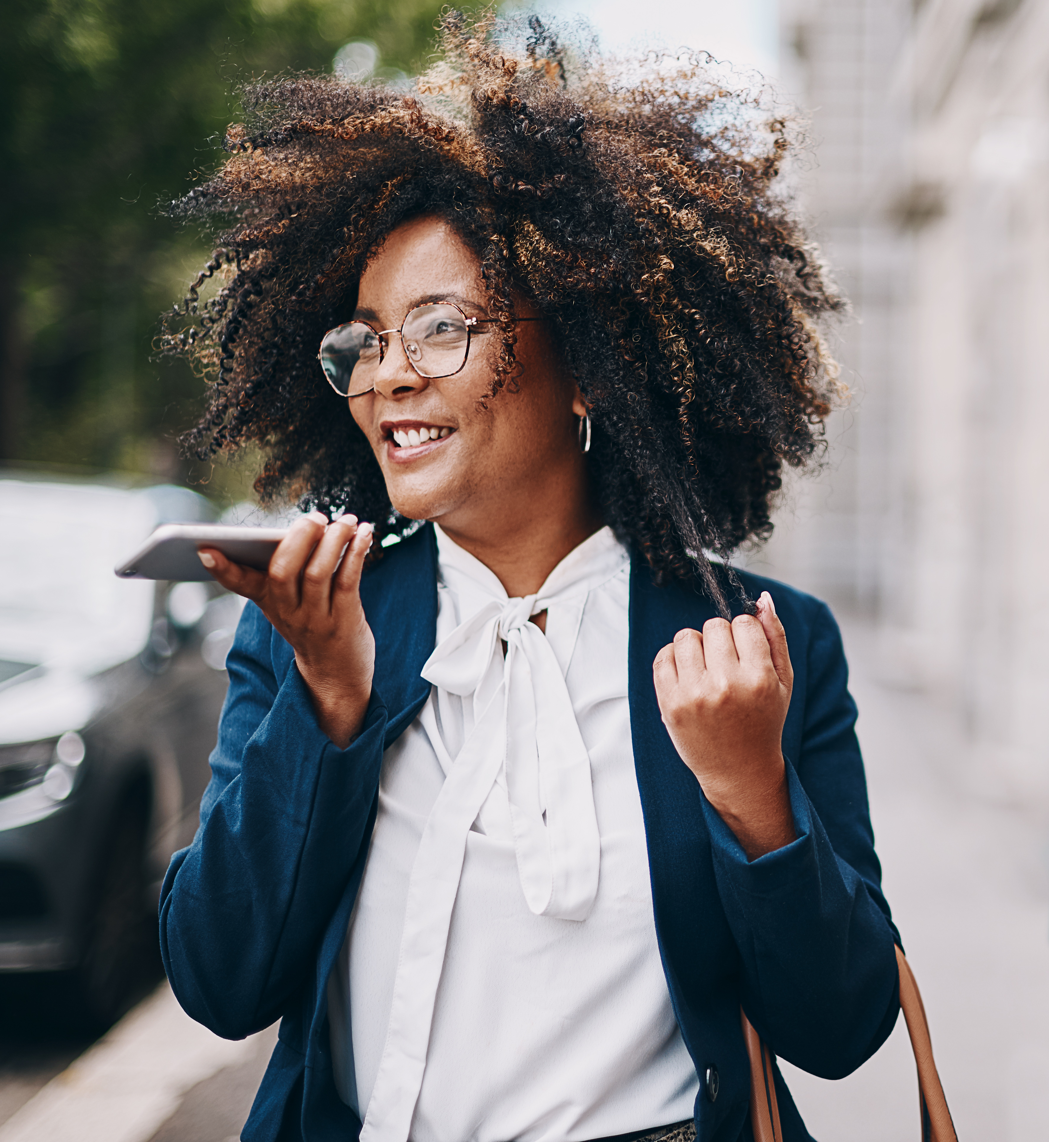 Shot of a businesswoman using her cellphone while out in the city; Mentorship